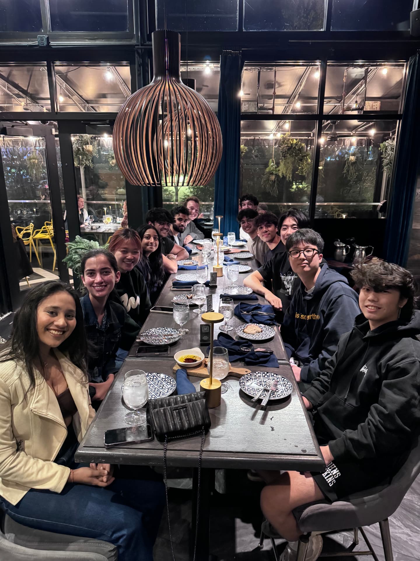 Cobalt members seated around a long table at a team dinner