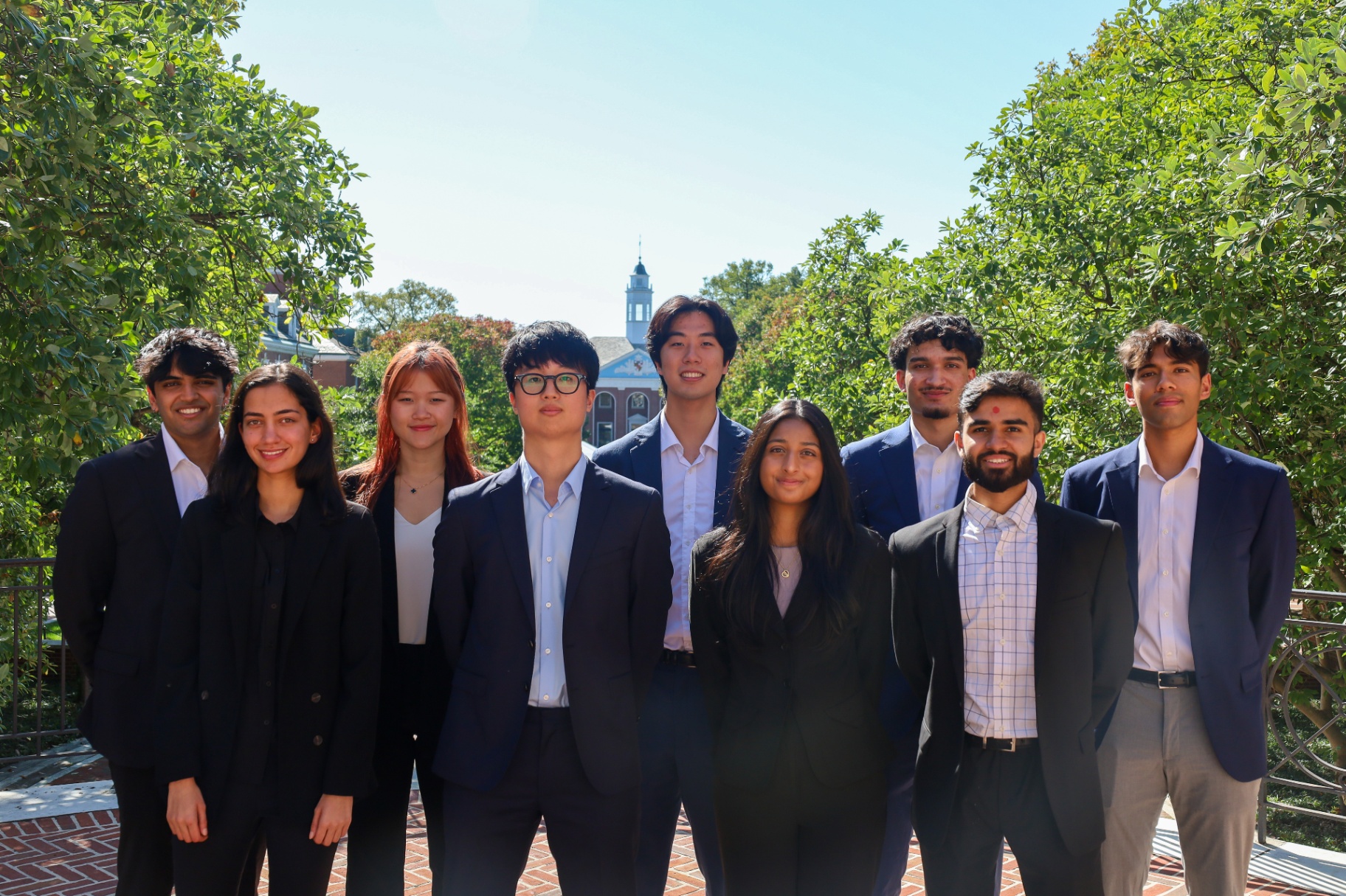 Cobalt Consulting Group undergraduate members in business attire on the Johns Hopkins Homewood campus